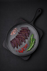 Delicious dried smoked beef or horse meat jerky with spices and salt