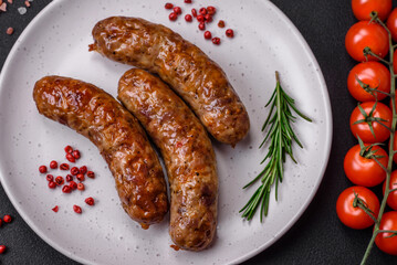 Delicious fried grilled sausages with salt, spices and herbs