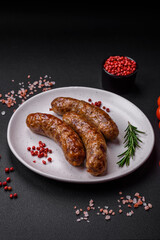 Delicious fried grilled sausages with salt, spices and herbs