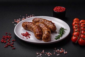 Delicious fried grilled sausages with salt, spices and herbs