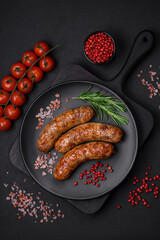 Delicious fried grilled sausages with salt, spices and herbs