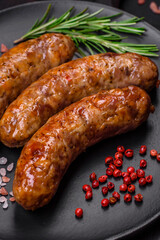 Delicious fried grilled sausages with salt, spices and herbs