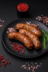 Delicious fried grilled sausages with salt, spices and herbs