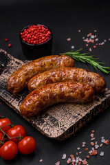 Delicious fried grilled sausages with salt, spices and herbs