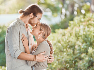 Devoted to you for life. Shot of a young couple spending time together in the garden at home.