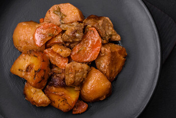 Delicious fresh cooked stew with pork meat or beef with potatoes, carrots, spices and herbs