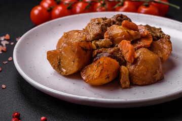 Delicious fresh cooked stew with pork meat or beef with potatoes, carrots, spices and herbs