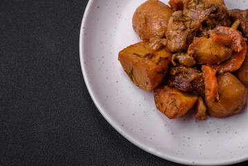 Delicious fresh cooked stew with pork meat or beef with potatoes, carrots, spices and herbs