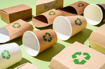 The concept of recycling and the use of biodegradable materials. Recycling sign on paper disposable...