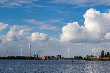 Fototapeta na wymiar Wind turbines along the Scheldt river, Antwerp, Belgium.