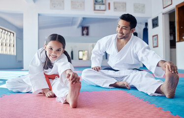 Every warrior was once a beginner. Shot of a young man and cute little girl practicing karate in a studio. © Siphosethu Fanti/peopleimages.com