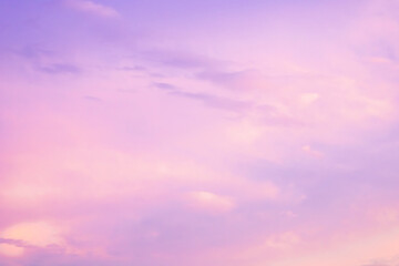 Majestic dusk. Sunset sky twilight in the evening with colorful sunlight. Trendy colors of the 2022. Abstract nature background. Calm gentle pink, viotel, purple and yellow clouds.