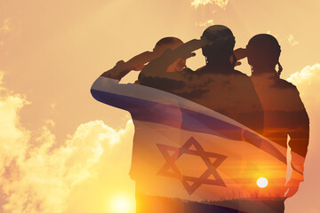 Double exposure of Silhouettes of a soliders and the sunset or the sunrise against Israel flag....