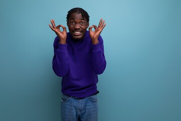 portrait of a funny dark-skinned african young guy in the studio