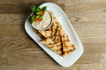 Feta cheese dip with dill, greek pita bread on the side