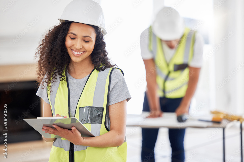 Poster weve got the go ahead to renovate. shot of an attractive young contractor standing inside and using 