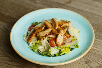 Caesar Salad with Grilled Chicken Stripes