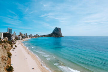 View to Mediterranean Sea with white sand beach, famous Rock Penon de Ifach in Calp, Alicante province, Valencian Community, Spain
