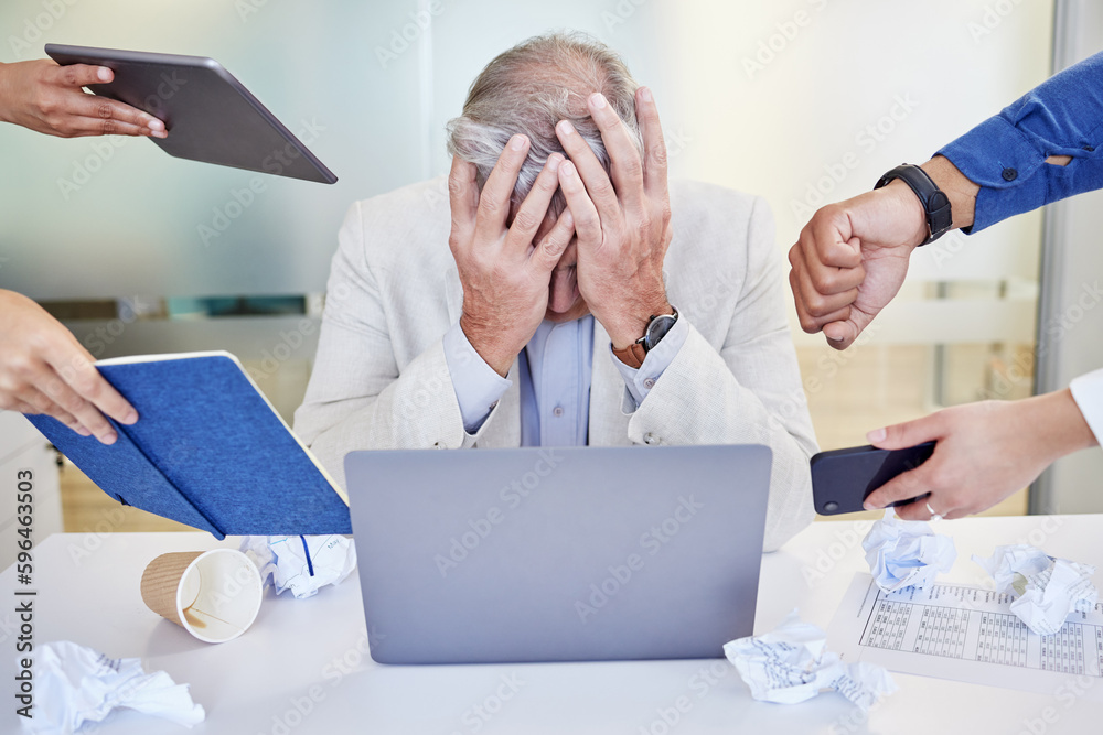 Poster when theres too much going on. shot of a mature businessman looking overwhelmed in a demanding work 