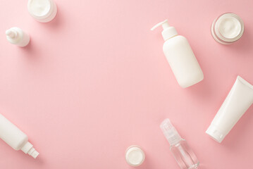 Gentle beauty care concept. Top view flat lay of pump bottle, pipette, cream bottles and tubes on...