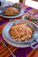 rice with shrimp on a metal pan and accompaniment from the Colombian tropics