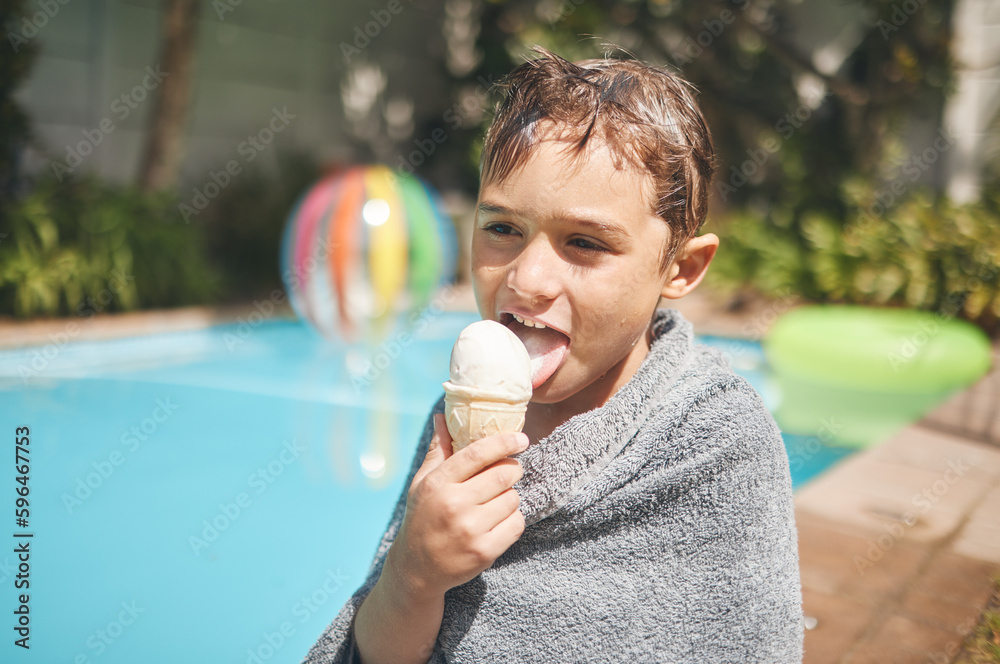 Wall mural Ice cream is the perfect summer snack. Cropped shot of an adorable little pool eating an ice cream while sitting outside by the pool.