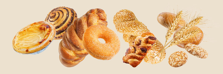 Set of fresh pastries such as cinnamon bun, croissant, bread, cookies