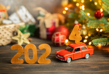 Wooden numbers 2024, toy car carries the number 4