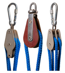 Three sailing blocks together with a rope on an isolated background.