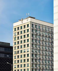 Fototapeta premium Large modern building detached, high-rise building in a modern city. Typical city block.