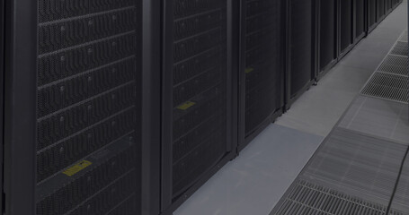 General view of empty server room with multiple black servers