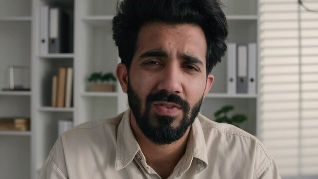 Webcam view Arabian muslim businessman tutor male coach Indian ethnic bearded man face talk in conference video call online meeting displeased office worker calling distant chat waving head rejection