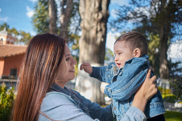 A Mother's Joy: White-skinned Latina Woman Beaming with Happiness as She Shares a Special Moment with Her Son in a La Paz Park on Mother's Day