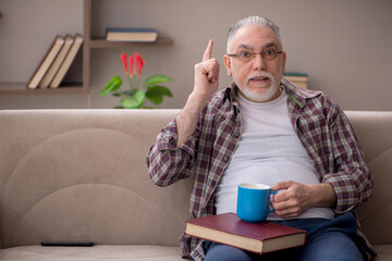 Old man sitting at home