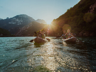 A group of friends enjoying fun and kayaking exploring the calm river, surrounding forest and large...