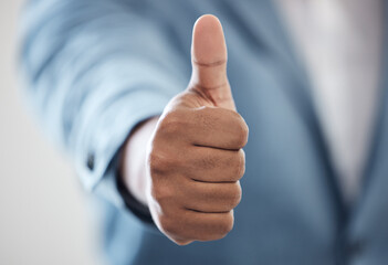 Believe in what youre able to achieve. Closeup shot of an unrecognisable businessman showing thumbs up in an office.