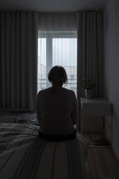 Mature Woman Sitting Alone In The Room, Sad Depressed Person. Back View. Mental Health