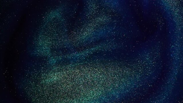 Slow-Motion Footage of Shiny Gold Dust Particles Creating Dynamic Waves and Overflows in a Blue Liquid. Wavy circular motion of sparkling gold particles in blue fluid with subtle green tint.