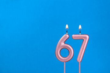 Candle number 67 - Birthday in blues foamy background