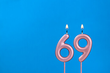 Candle number 69 - Birthday in blues foamy background