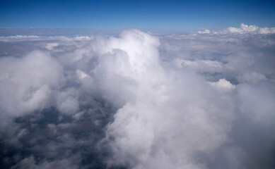 Naklejka na ściany i meble Clouds background. Flying into the clouds.