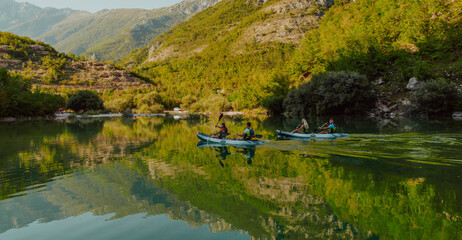 A group of friends enjoying having fun and kayaking while exploring the calm river, surrounding forest and large natural river canyons