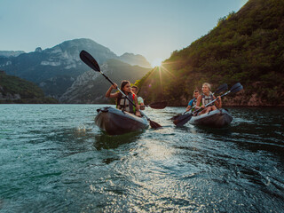A group of friends enjoying fun and kayaking exploring the calm river, surrounding forest and large...