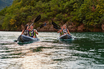 A group of friends enjoying having fun and kayaking while exploring the calm river, surrounding forest and large natural river canyons