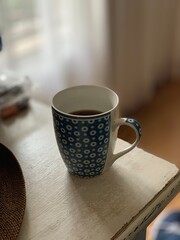 cup of coffee on wood table