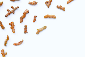 Turmeric roots on white background.