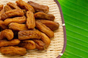 Sun-dried bananas in bamboo weave plate