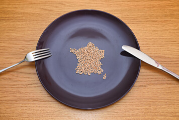 Wheat on a plate laid out in the shape of a map of France. Food concept