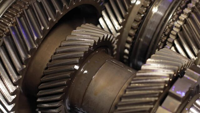 Gear mechanism process Rotating gears. works from within. movable gearbox. Close-up. Gearbox gears isolated