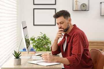 Man studying near computer at home. Online translation course